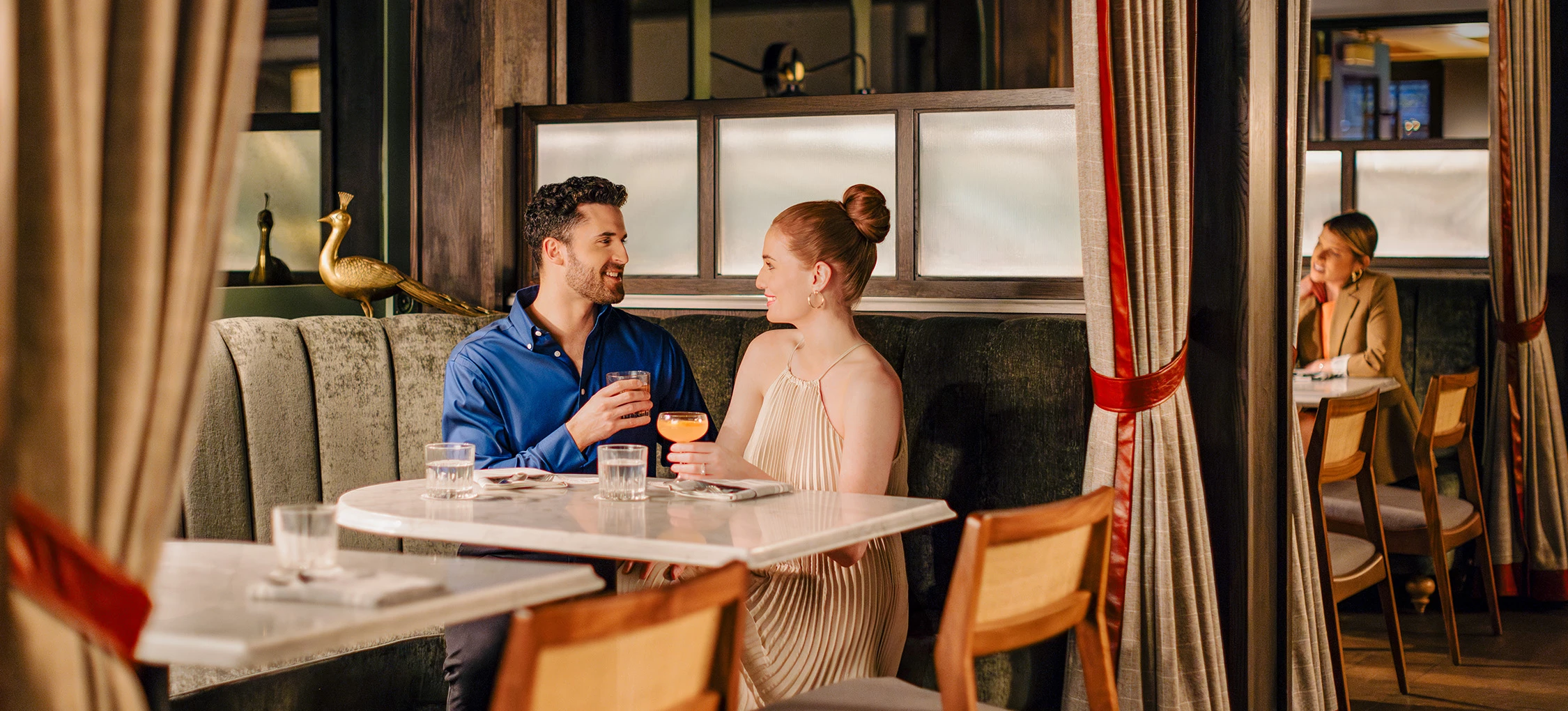 a man and woman sitting at a table