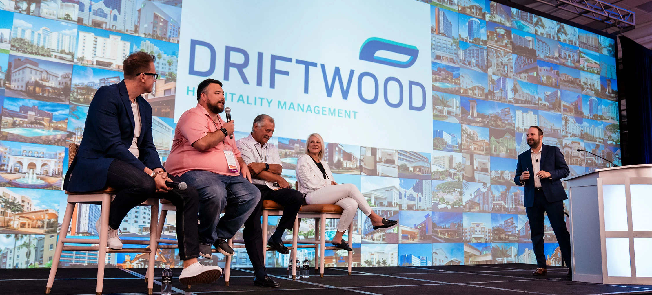 a group of people sitting on a stage