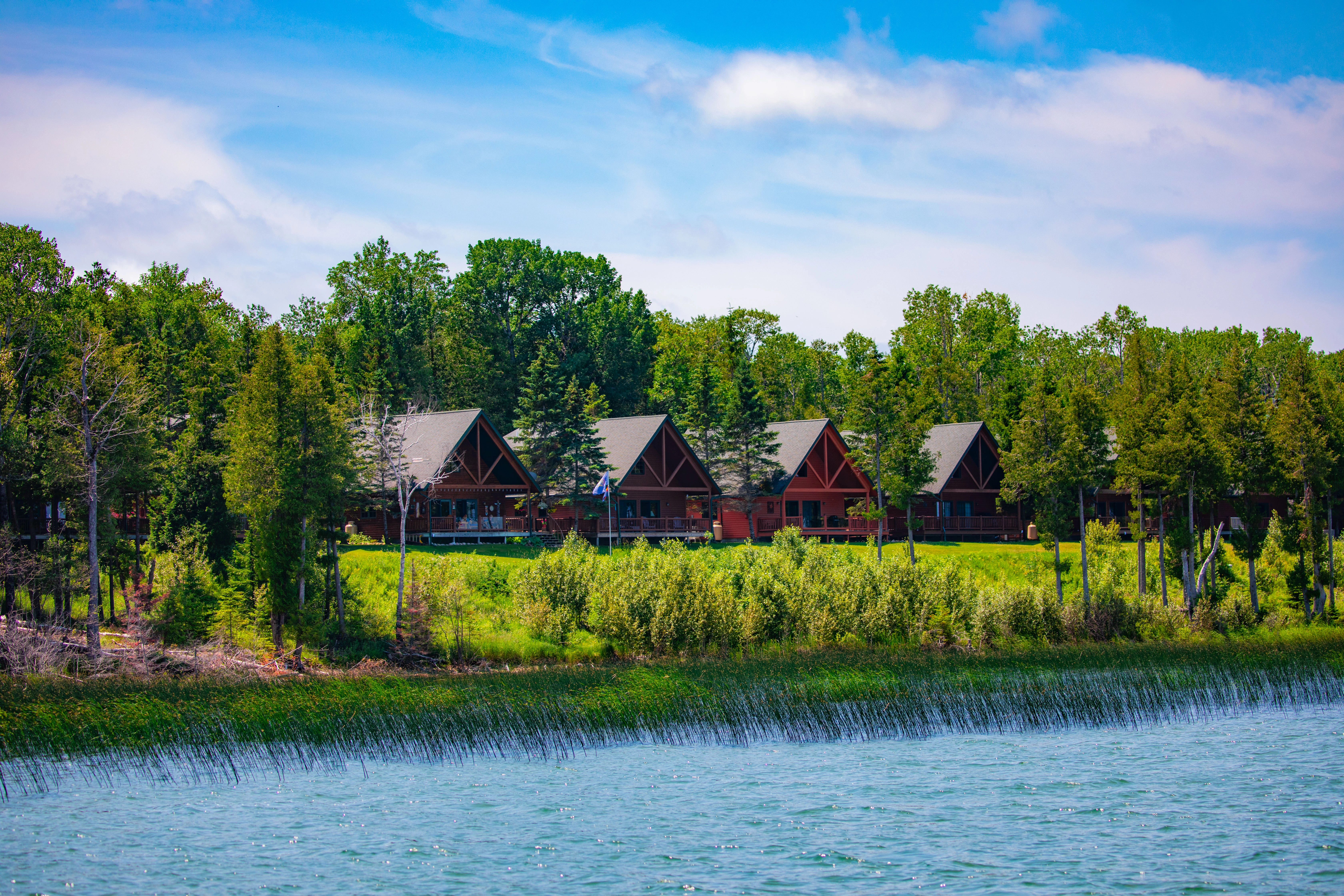 a row of cabins by a lake