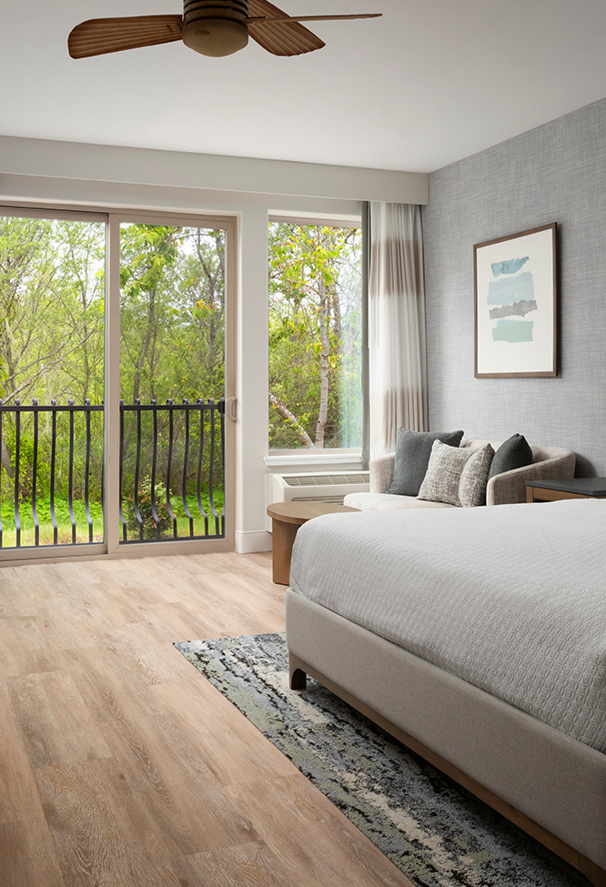 a bedroom with a bed and a couch