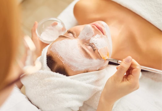 a woman with a white mask on her face