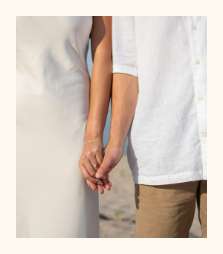 a man and woman holding hands