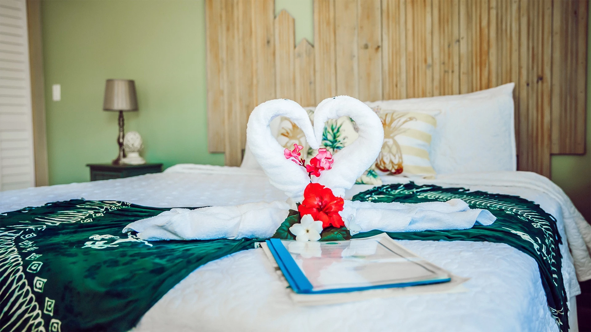 a towel swans on a bed