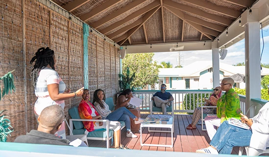 a group of people sitting on a porch