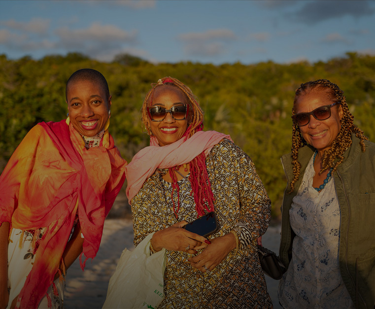 a group of women smiling at the camera