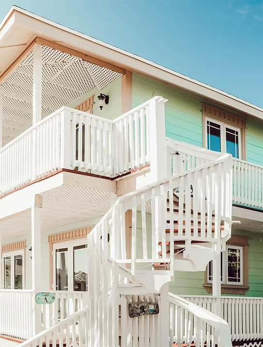 a spiral staircase in front of a house