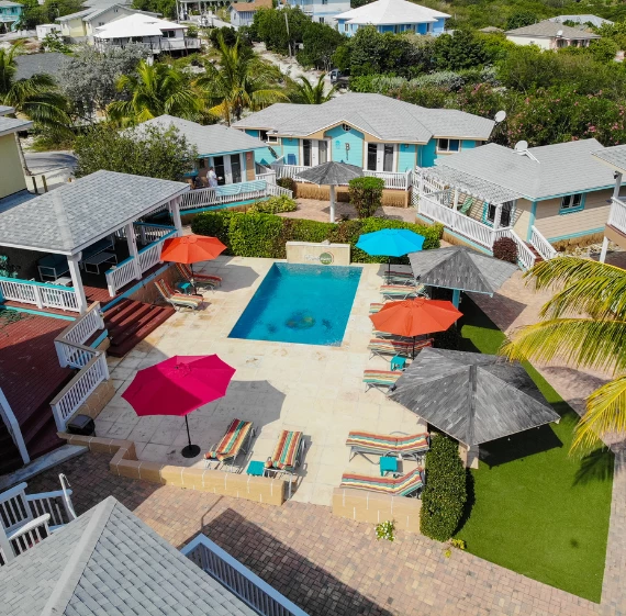 a pool and umbrellas in a resort