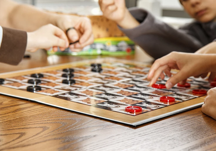 a group of people playing a board game