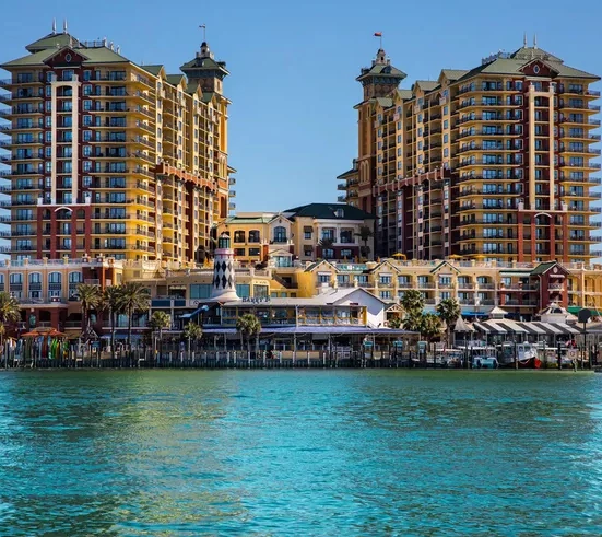 a group of buildings next to a body of water