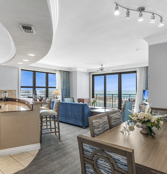 a room with a table and chairs and a bar