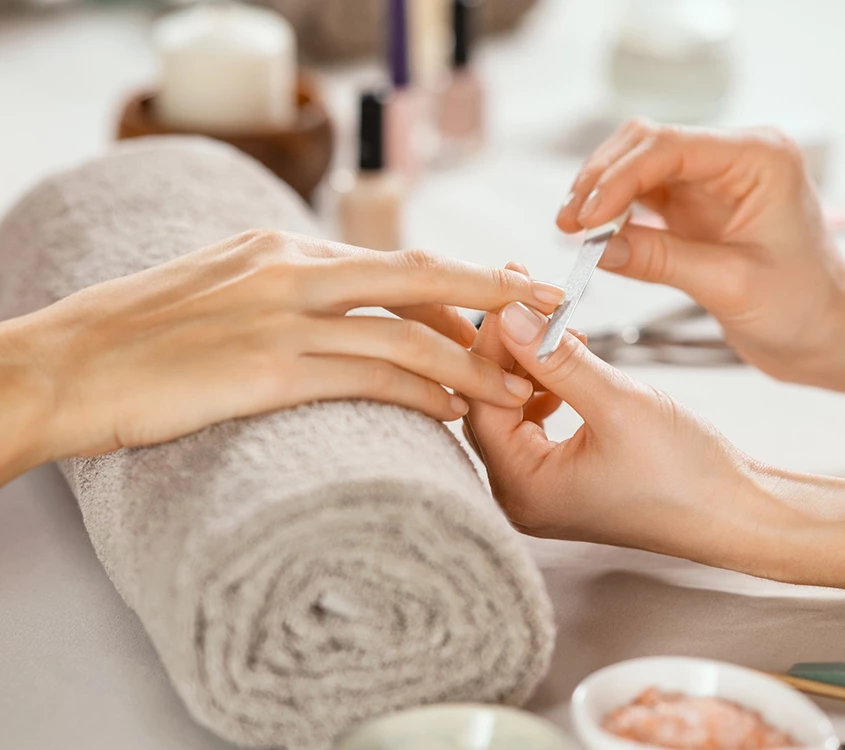 a person getting manicure done