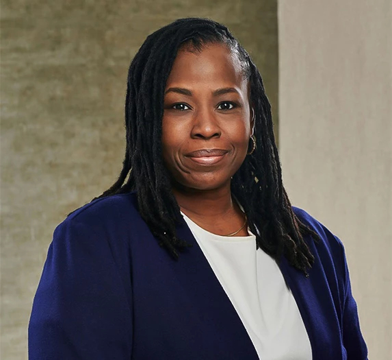 a woman with dreadlocks smiling