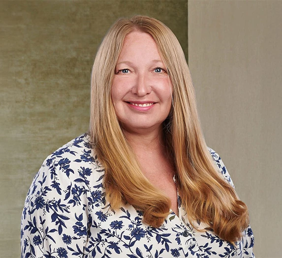 a woman with blonde hair smiling