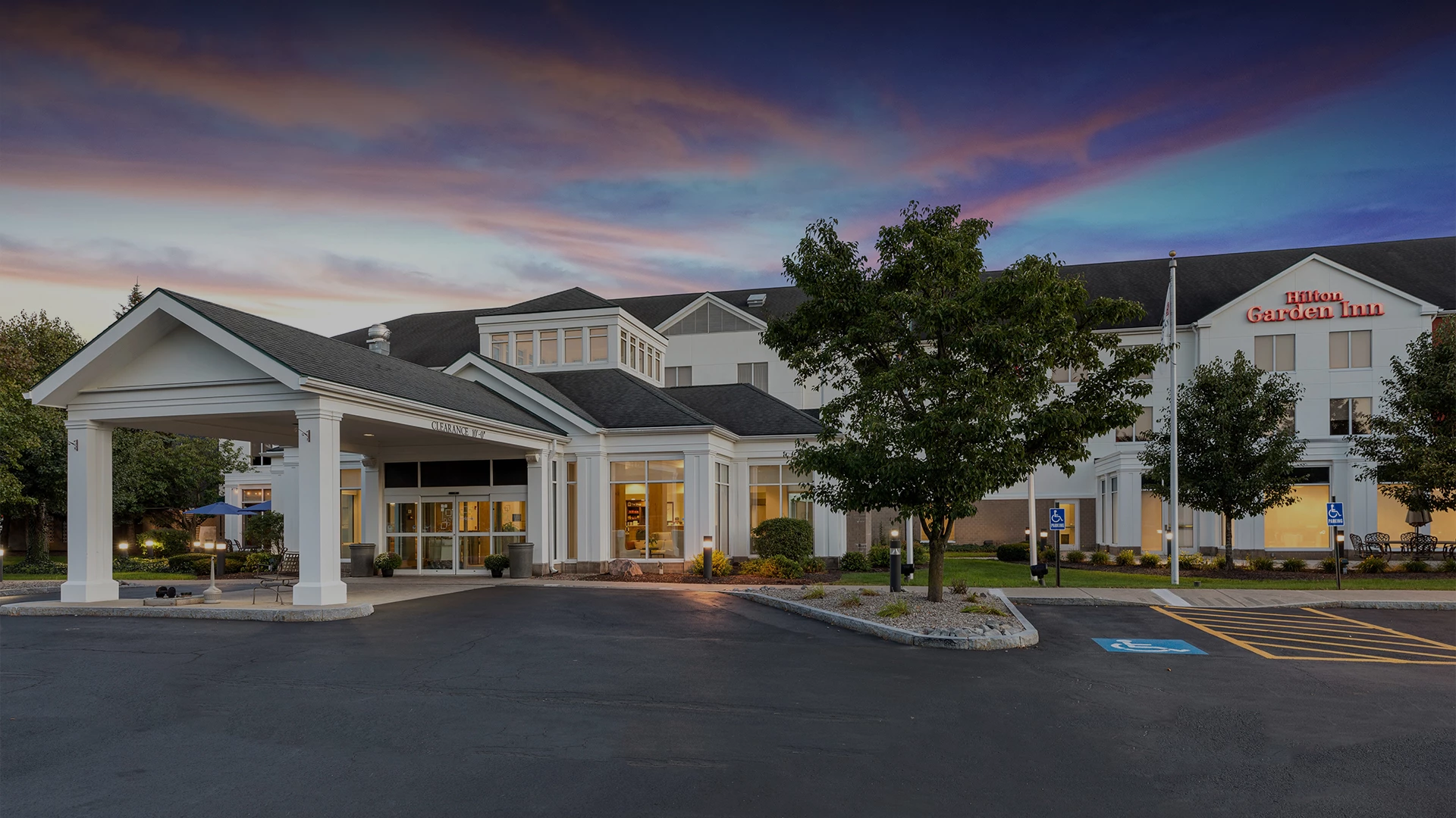 a large building with a tree in front of it