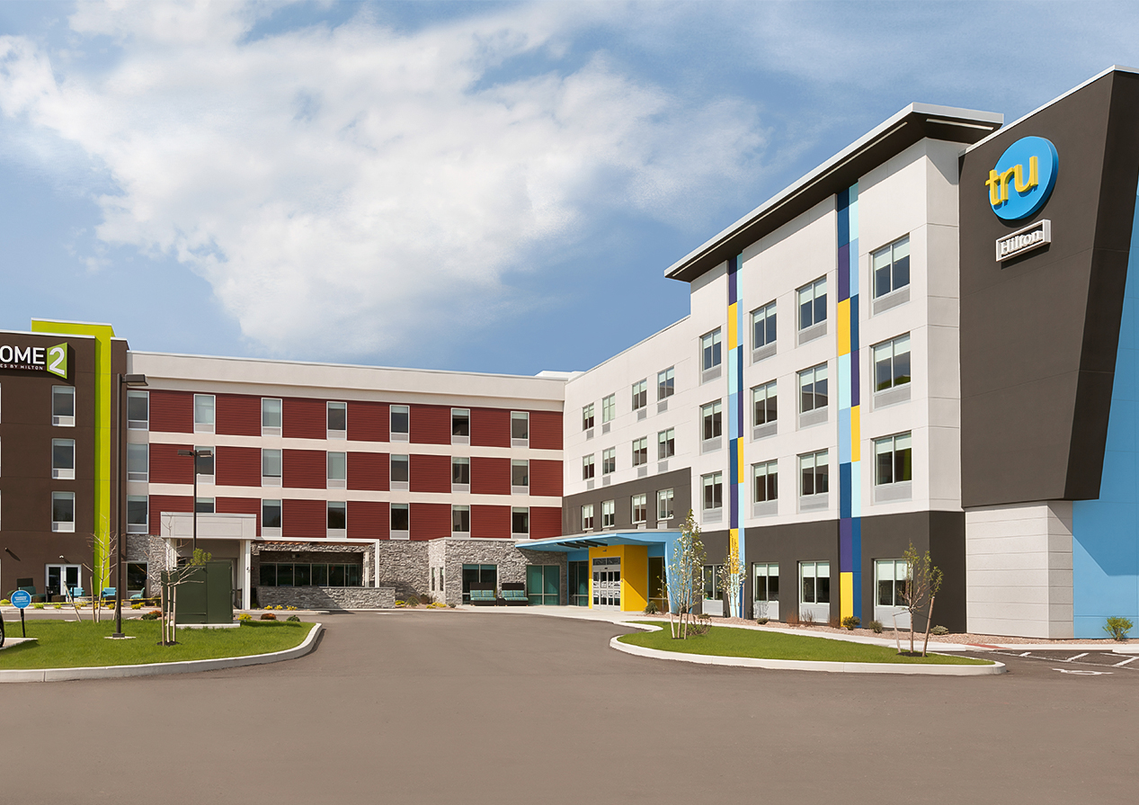 a multi-story building with a circular driveway