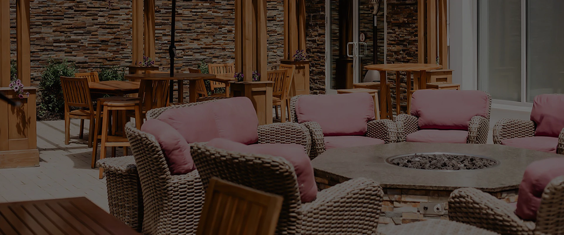 a patio with chairs and tables