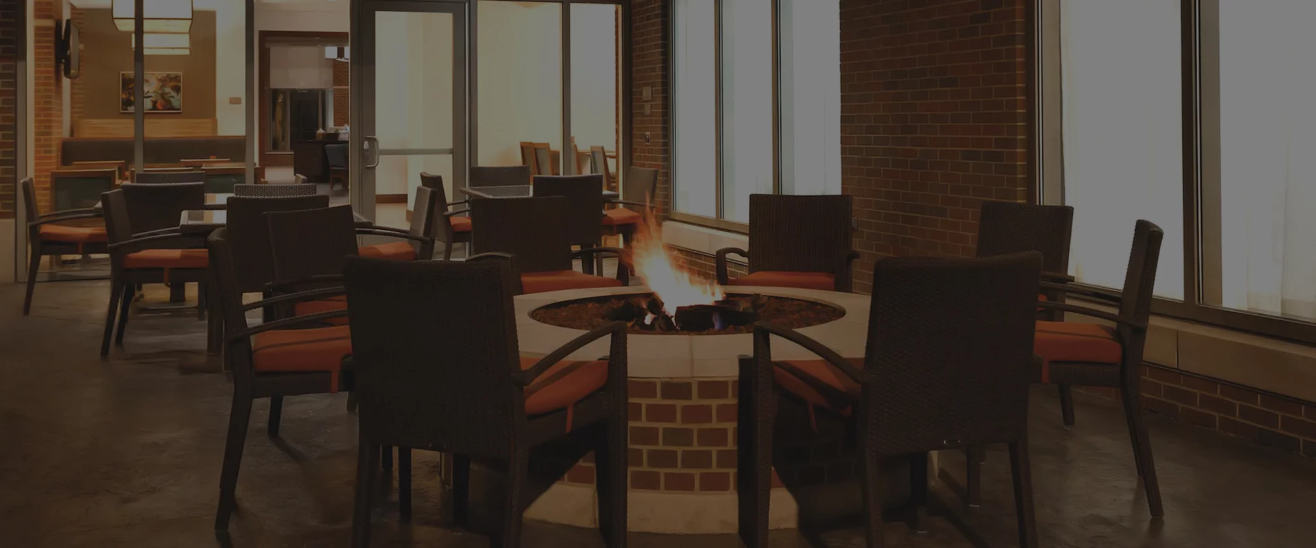 a fire pit with chairs around it