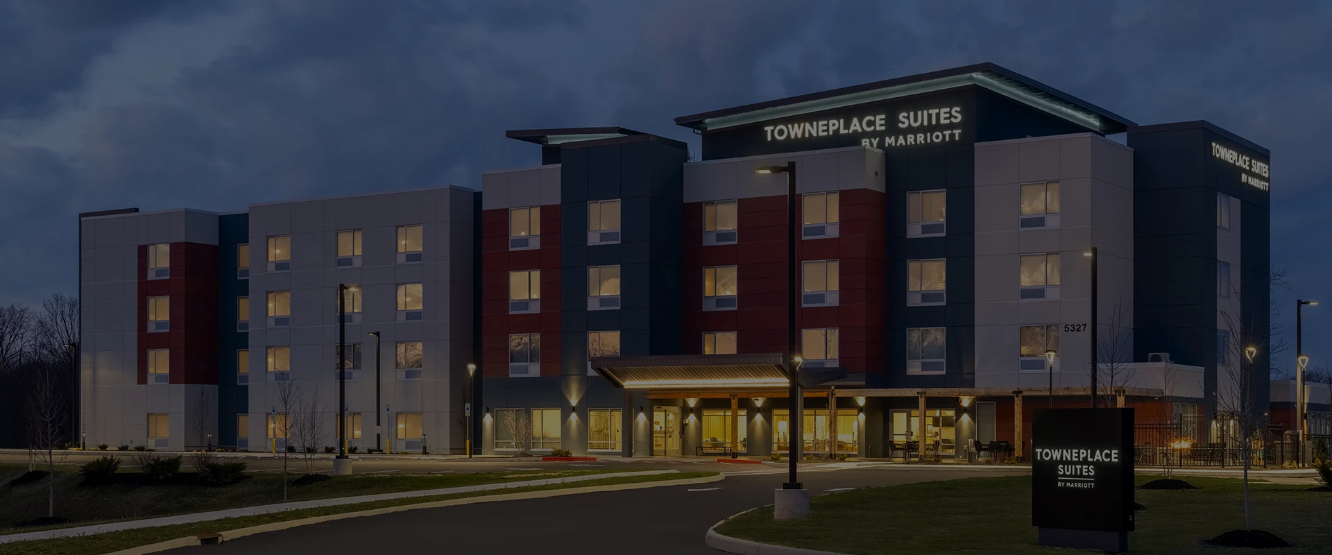 a building with a street and a sign