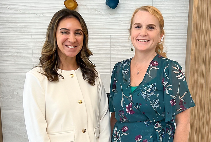 two women smiling at the camera