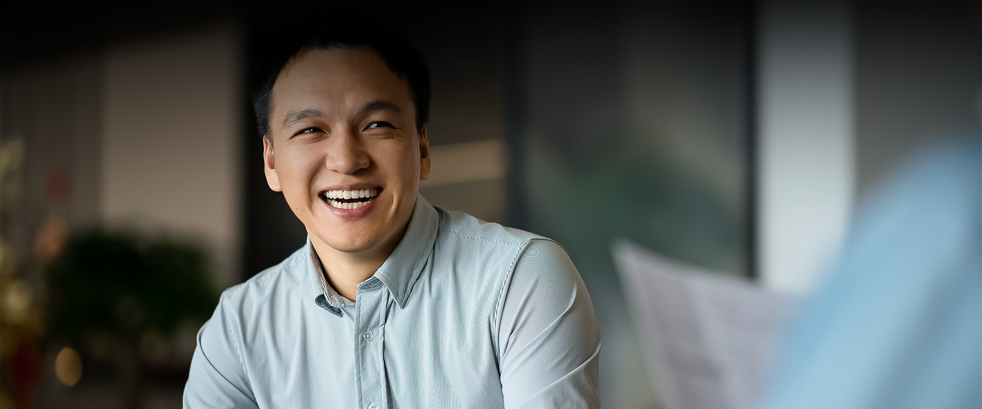 a man smiling with a smile