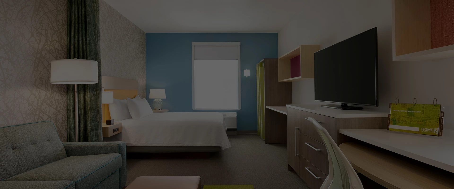 a room with a bed and a tv