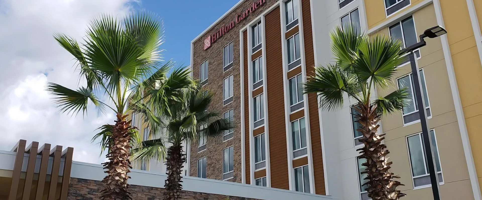 a building with palm trees