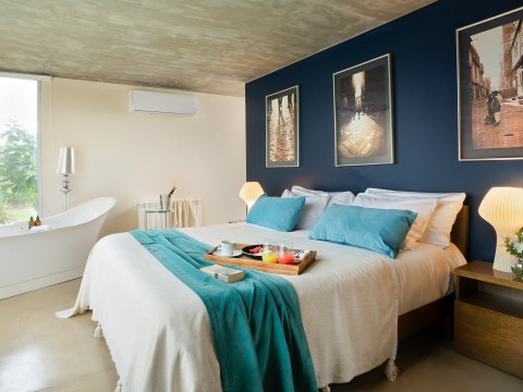 a bed with a tray of food on it