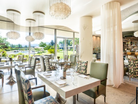 a restaurant with tables and chairs