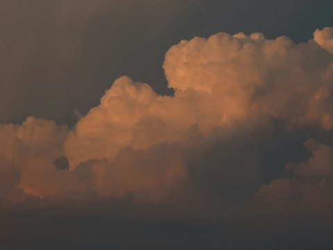 a large white clouds in the sky