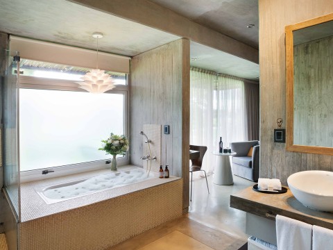 a bathroom with a bathtub and a sink