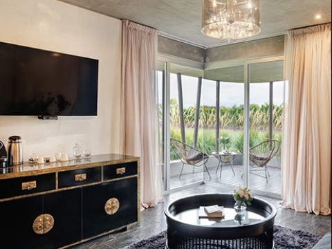 a living room with a television and a couch