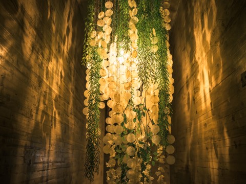 a light shining through a ceiling