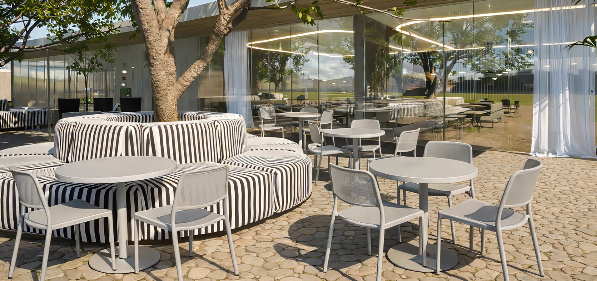 a patio with tables and chairs