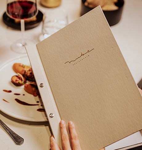 a person holding a menu