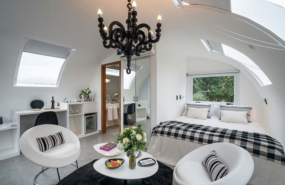 a bedroom with a bed and a table