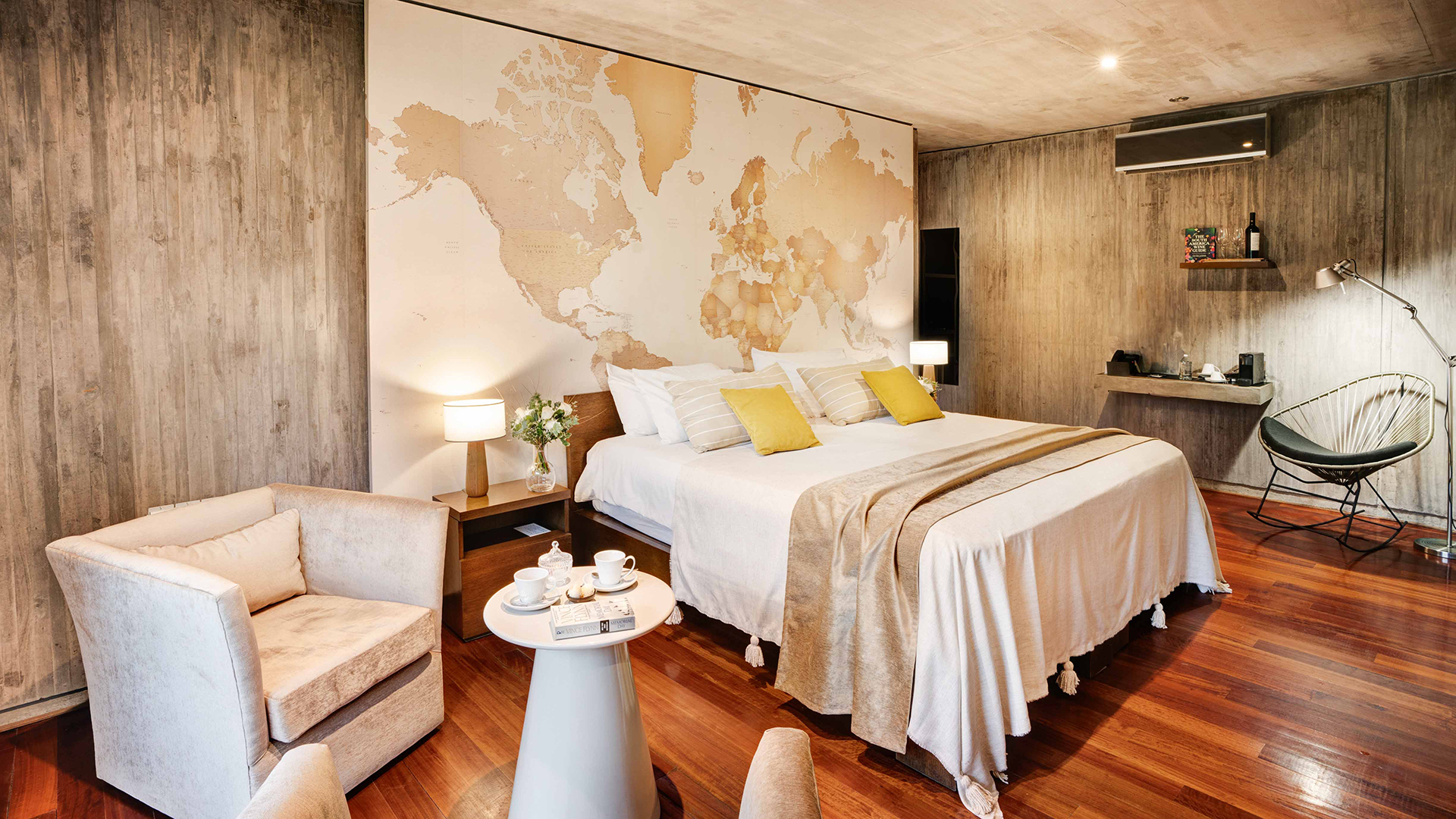 a room with a bed and a map of the world