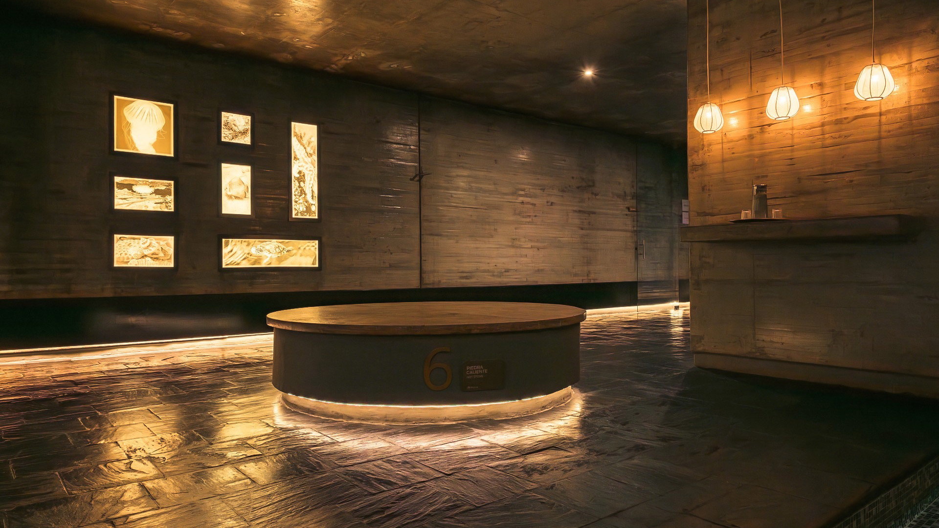 a round wooden platform with lights in a room