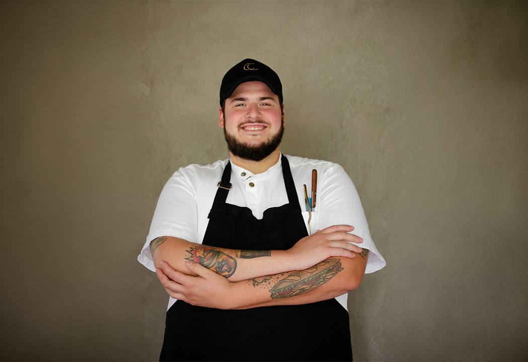 a man with tattoos on his arms