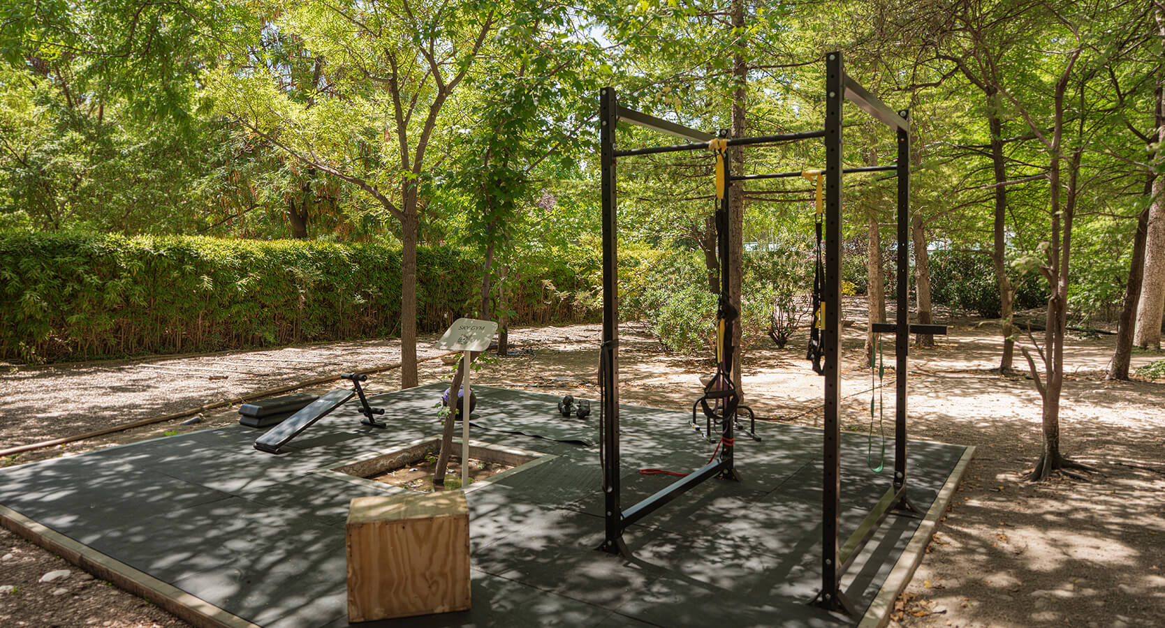 a outdoor gym with a bench and a box