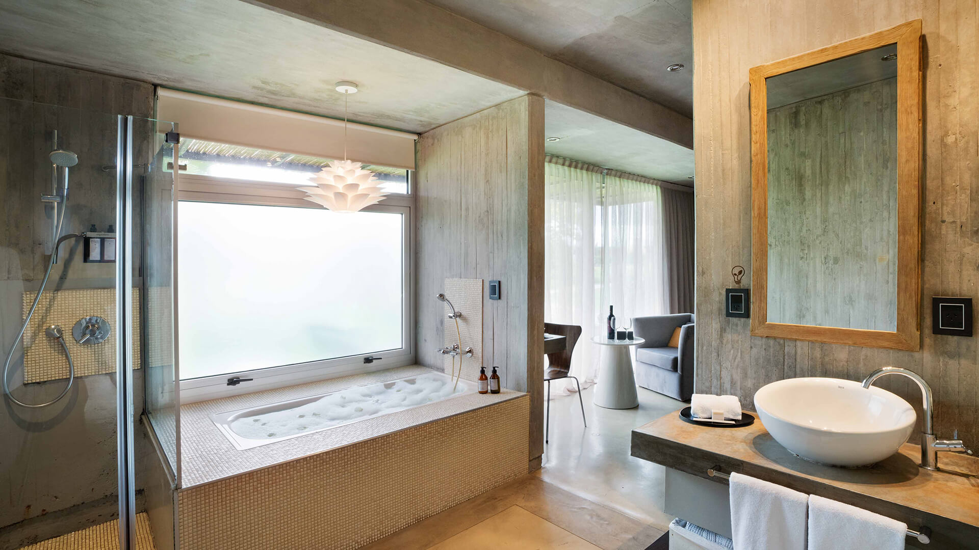 a bathroom with a large tub and a sink