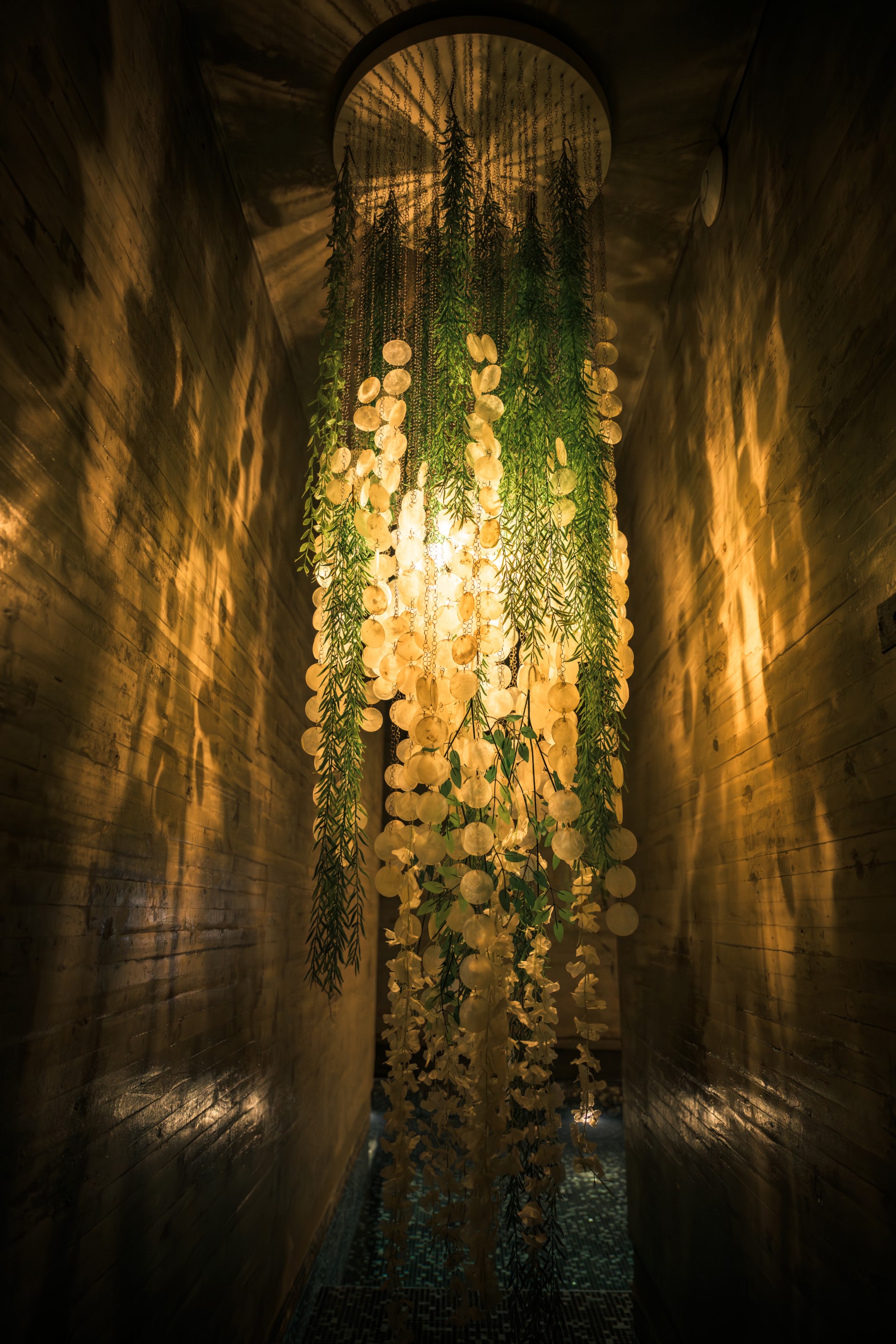 a light shining through a ceiling