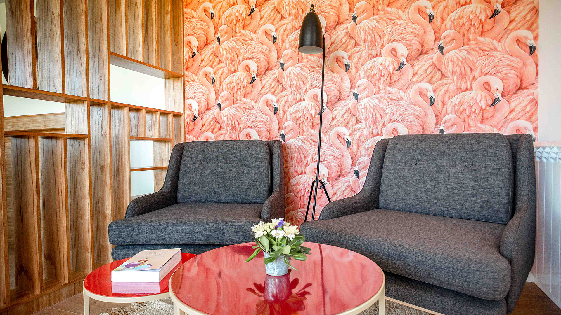 a room with a red table and two chairs