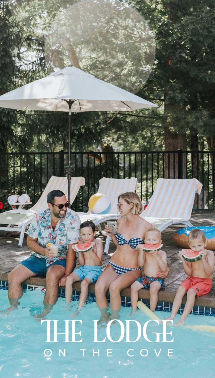 a group of people sitting on a pool side eating watermelons
