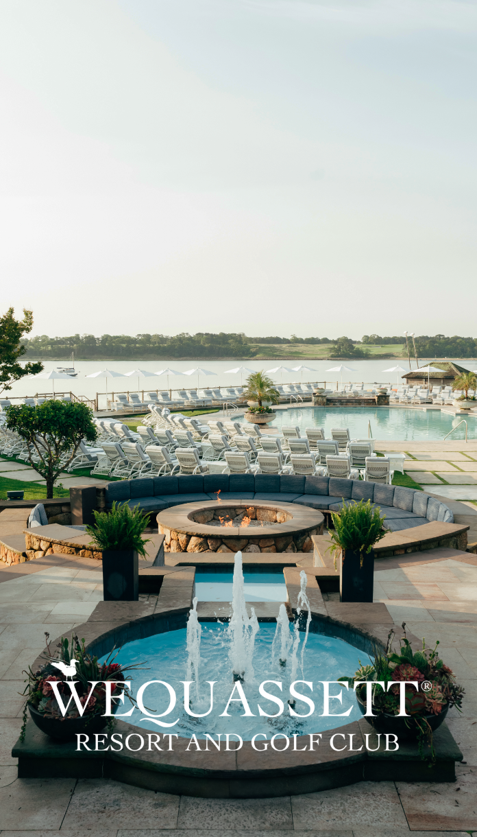 a pool with a fire pit and chairs