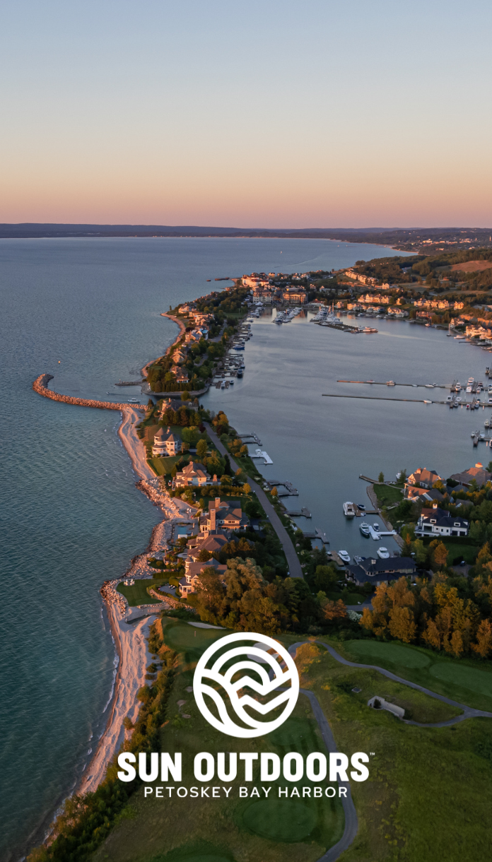 a aerial view of a body of water with houses and boats