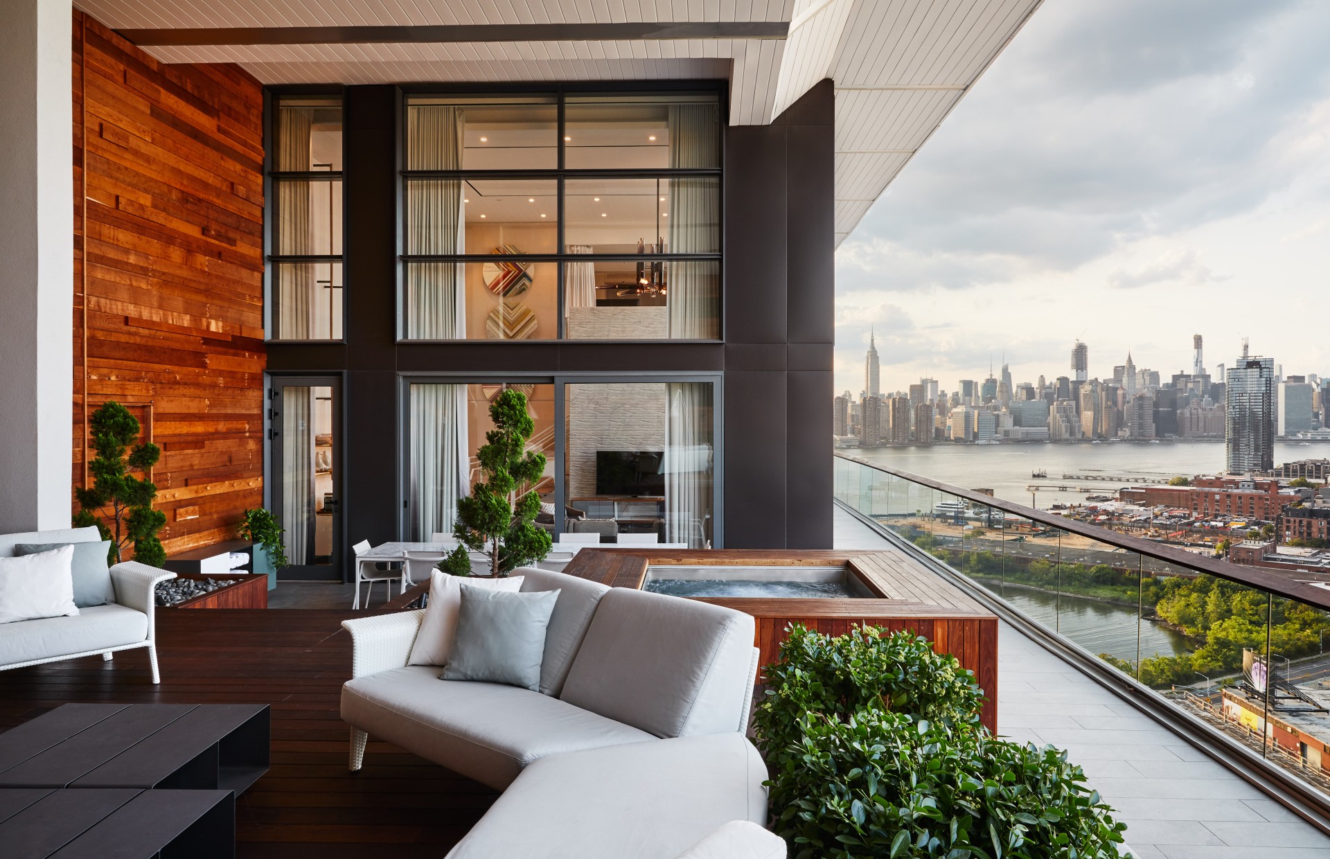 a balcony with a view of a city and a river