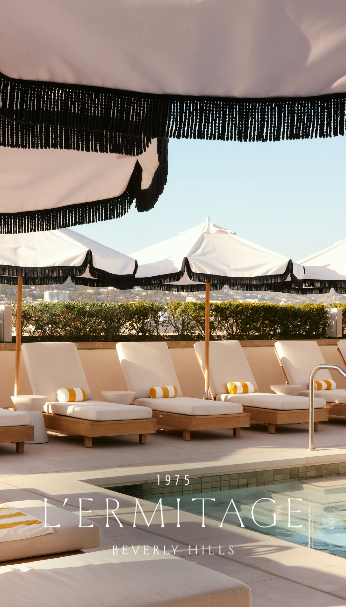 a group of lounge chairs and umbrellas