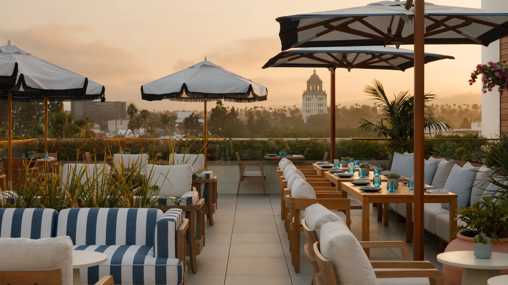 a table and chairs on a patio on a rooftop
