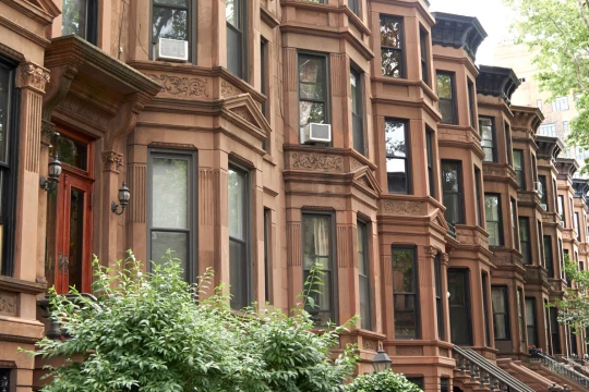 a row of brown buildings