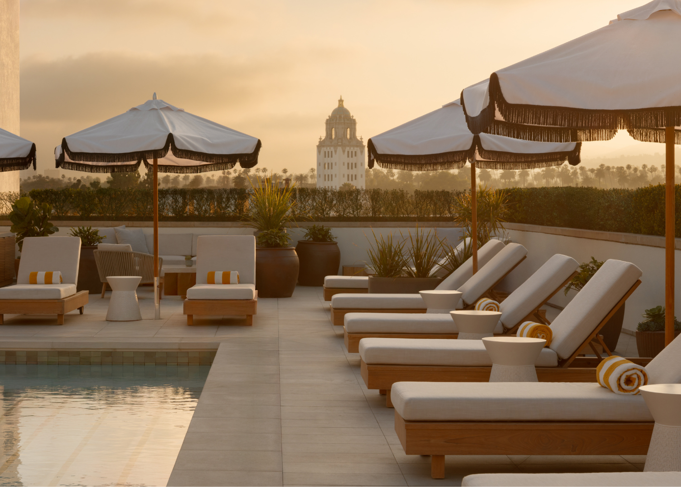 a pool with chairs and umbrellas